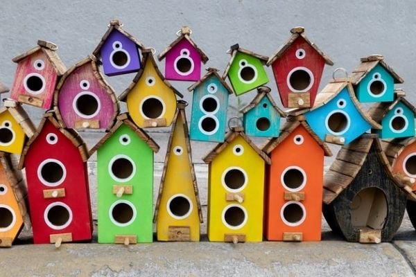 painted bird house made of wood